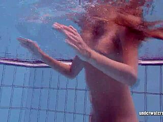 Softcore video of a young girl getting surprised underwater