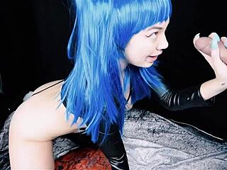 Blue-haired girl in crossdressing role serves with sloppy blowjob in BDSM video