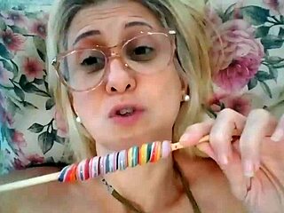 Stella Still's sensual oral pleasure with lollipop