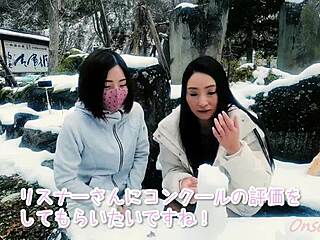 Asian beauty enjoys snow sculpture playtime